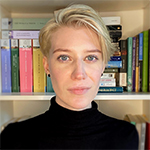 Head shot of Alexandra Gustafson in front of a bookshelf
