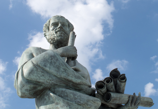 Aristotle statue holding scrolls