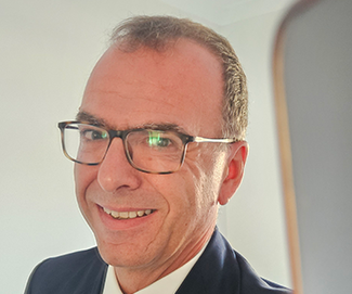Man wearing glasses and suit