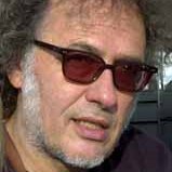 Man with sunglasses and salt and pepper short beard