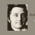 Black-and-white head shot of Robert A. Imlay in the 1960s or 1970s, on a gray background with the words, "In memoriam Robert A. Imlay, 1937-2023"