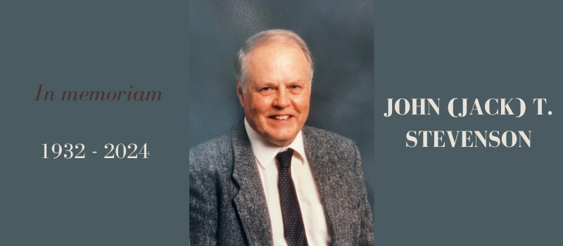 On a gray background, an image of Jack Stevenson, a white-haired white man in a suit smiling into the camera. Around him the words: "In memoriam John (Jack) T. Stevenson, 1932-2024"