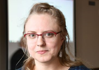 Woman with glasses and hair pulled back