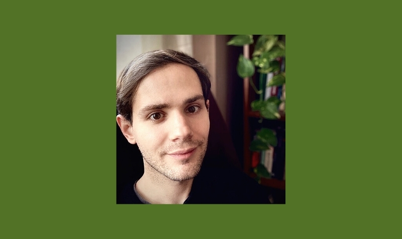 Headshot of Robbie Matyasi on green background