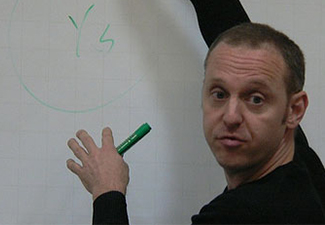 Ted Sider teaching at a white board
