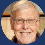 Older man wearing glasses with grey hair in centre, blue background with text stating Defending Morality and Wayne Sumner