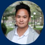 On a U of T blue background, with his full name in green, a portrait shot of Andrew Lee, a young East Asian man with short black hair smiling in front of the backdrop of an urban park.