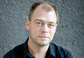 Head shot of Matti Eklund against a gray background