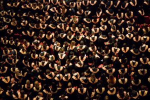 Overhead shot of crowd of graduates in gowns
